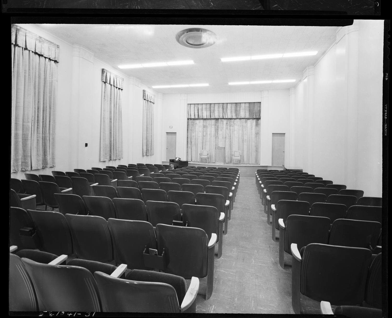 The auditorium in May 1950, shortly after the Baptist Building opened, with its original stage curtains